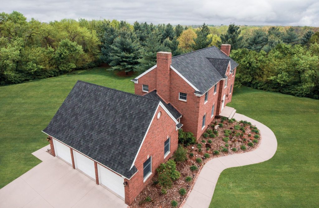 Malarkey Windsor Scotchgard designer shingles on a brick two-storey home