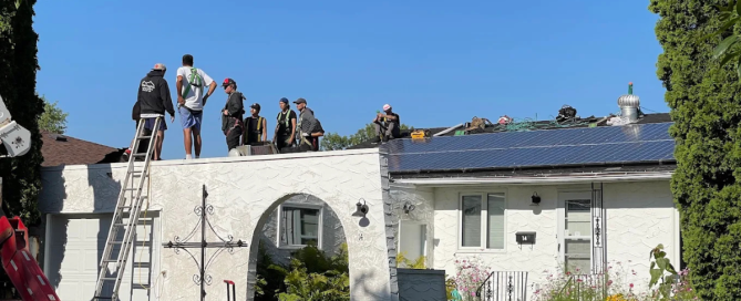 New Heights Roofing crew working on a residential roof replacement in Winnipeg on a sunny summer day