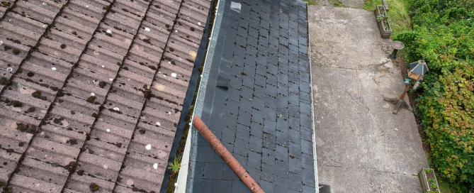 Aerial view of hail damage on a residential roof showing impact marks across shingles